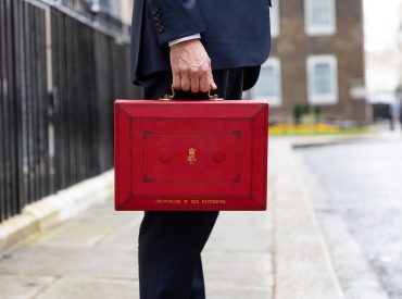 politician holding the red budget box