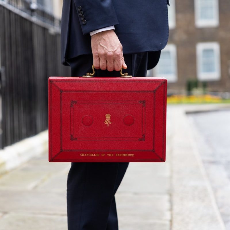 politician holding the red budget box